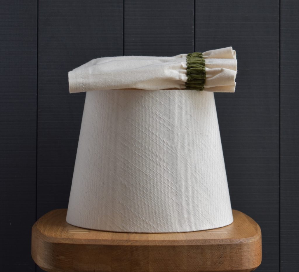 Dolly Cream Scrunchie Lampshade with a green velvet trim - Image 2