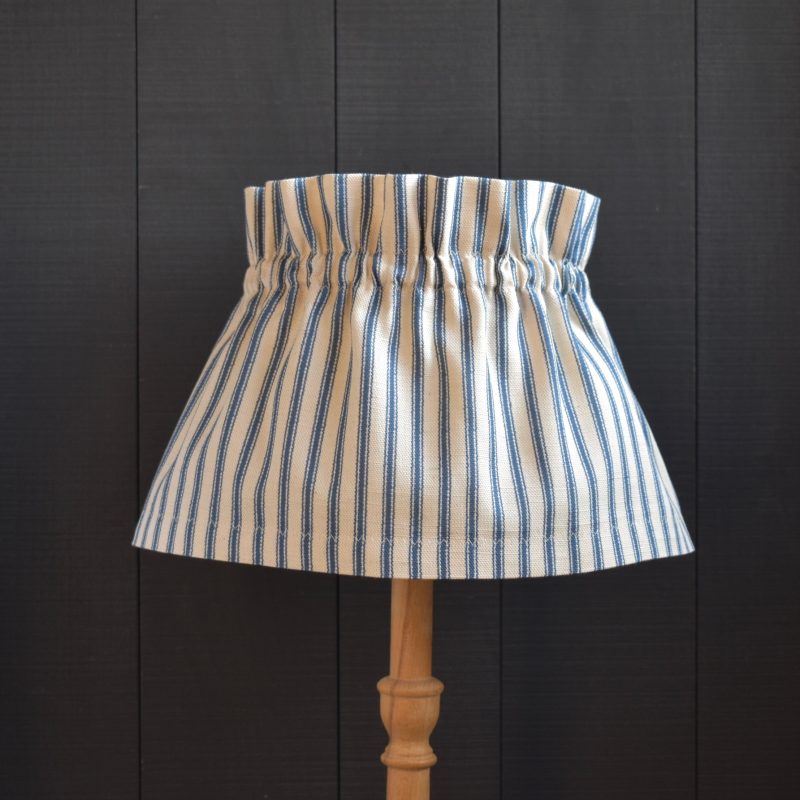 Dolly Blue Ticking Stripe Scrunchie Lampshade. This a two piece set, the cover and the linen lampshade underneath. The cover slips on top easily, gathers beautifully and can be removed for hand washing.