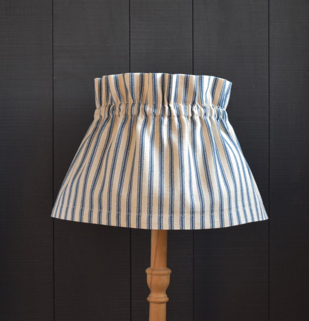 Dolly Blue Ticking Stripe Scrunchie Lampshade. This a two piece set, the cover and the linen lampshade underneath. The cover slips on top easily, gathers beautifully and can be removed for hand washing.